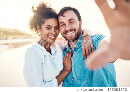 Selfie, smile and happy couple on beach for holiday to celebrate love, marriage and memory on social media. Digital photography, man and woman relax on ocean vacation together in summer with nature. Selfie, smile and happy couple on beach for holiday to celebrate love, marriage and memory on social media. Digital photography, man and woman relax on ocean vacation together in summer with nature. 136361250