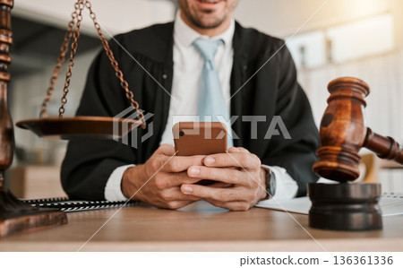 Judge, hands and professional man typing communication, networking or texting legal contact, law firm consultant or advocate. Government lawyer, smartphone and person reading attorney policy update 136361336