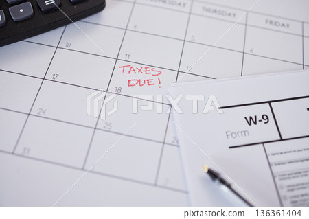 Tax, calendar and reminder on schedule for government compliance, deadline and remember date for paperwork and form. Taxes, financial audit and due payment of money, savings or income profit 136361404