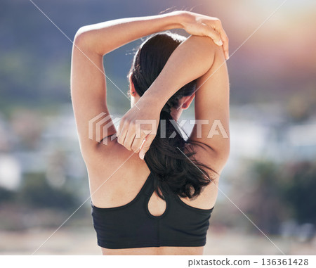 Fitness, woman back and stretching arm in city for running, workout and body, exercise or wellness routine. Hands, stretch and behind lady runner outdoor for training, sports or physical performance Fitness, woman back and stretching arm in city for running, workout and body, exercise or wellness routine. Hands, stretch and behind lady runner outdoor for training, sports or physical performance 136361428