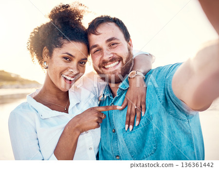 Selfie, holiday and happy couple celebrate engagement, marriage and beach memory on social media. Digital photography, man and woman relax on ocean vacation together with smile, love and wedding ring 136361442