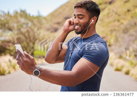 Fitness, happy man or runner with music on mobile app online in training, workout or exercise on road. Headphones, radio audio or healthy athlete listening or streaming podcast to start running Fitness, happy man or runner with music on mobile app online in training, workout or exercise on road. Headphones, radio audio or healthy athlete listening or streaming podcast to start running 136361477