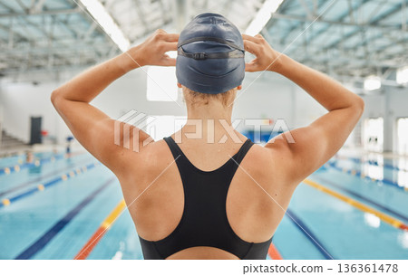 Woman, back and ready by swimming pool for fitness competition, training and gym exercise. Athlete, swimmer and person with water sports gear, cap and swimsuit in workout challenge, race and practice 136361478
