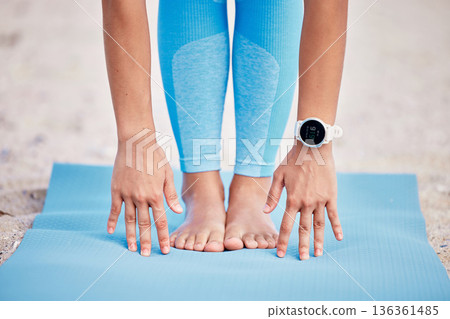 Hands, feet and yoga with a person at the beach for fitness, wellness or health outdoor in the fresh air. Exercise, nature and relax with legs stretching on a mat for pilates training or workout Hands, feet and yoga with a person at the beach for fitness, wellness or health outdoor in the fresh air. Exercise, nature and relax with legs stretching on a mat for pilates training or workout 136361485