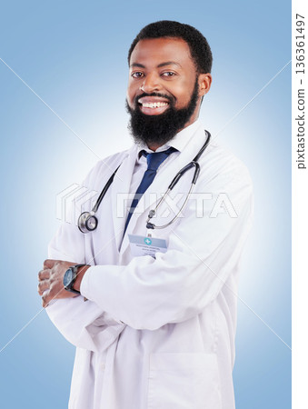 Black man, doctor and portrait with arms crossed in studio or happy medical expert or healthcare worker on blue background. African surgeon, smile and confidence in medicine or research in hospital 136361497