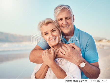 Beach, love and portrait of senior couple hugging in nature, holiday or romantic outdoor date together at the ocean, sea or sand. Happy, smile and people in a hug, embrace or happiness on anniversary Beach, love and portrait of senior couple hugging in nature, holiday or romantic outdoor date together at the ocean, sea or sand. Happy, smile and people in a hug, embrace or happiness on anniversary 136361506