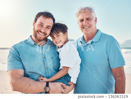 Father, grandfather and a child happy at the beach while on a family vacation, holiday or adventure. A senior man, dad and boy kid together while outdoor for summer fun, portrait and travel by sea Father, grandfather and a child happy at the beach while on a family vacation, holiday or adventure. A senior man, dad and boy kid together while outdoor for summer fun, portrait and travel by sea 136361529