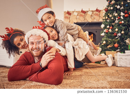 Christmas, portrait and happy family in home on floor, bonding and together. Xmas, smile and face of parents with children, interracial and African mom with father for party, celebration or holiday Christmas, portrait and happy family in home on floor, bonding and together. Xmas, smile and face of parents with children, interracial and African mom with father for party, celebration or holiday 136361530