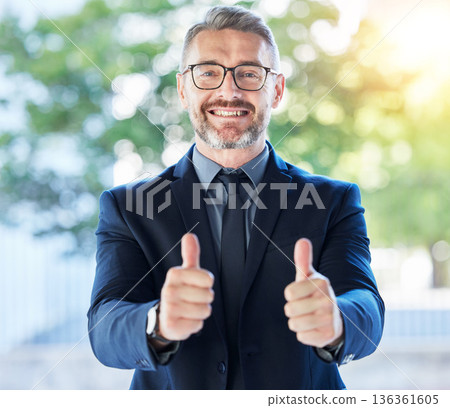 Business man, senior executive and thumbs up, support and agreement in portrait with smile and positive feedback. Male CEO, corporate deal and yes vote with voice, emoji and like, happy with opinion 136361605