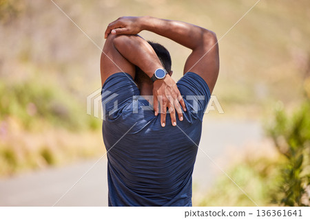 Fitness, man or runner stretching arms for fitness training, wellness or cardio exercise outdoors on road. Relax, flexibility and back view of healthy male athlete in warm up to start running workout Fitness, man or runner stretching arms for fitness training, wellness or cardio exercise outdoors on road. Relax, flexibility and back view of healthy male athlete in warm up to start running workout 136361641