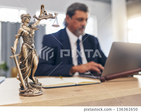 Justice, statue and man in office with laptop at law firm desk, online research for court advice and senior lawyer. Judge, attorney or legal consultant in human rights, computer and internet search. Justice, statue and man in office with laptop at law firm desk, online research for court advice and senior lawyer. Judge, attorney or legal consultant in human rights, computer and internet search. 136361650