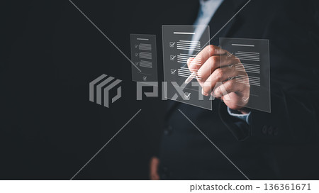 business professional uses a digital pen with floating virtual documents featuring checkmarks, representing electronic signature, document management, workflow automation, and approval systems. 136361671