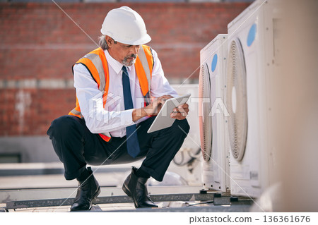 Air conditioner, roof and engineering man on tablet, maintenance and check electrical power, generator and fan. Electrician person on digital tech for ac repair, electricity inspection and services 136361676