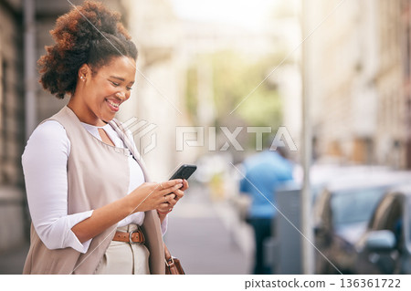 Phone, city and business woman walking and travel in a town typing on social media, online or internet. Connection, smile and happy African person texting a contact via email, web or mobile app 136361722