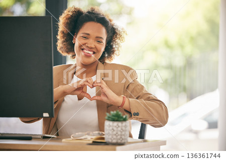 Portrait, business woman and smile with heart hands in office for care, kindness or love emoji. Happy young African female worker with finger shape for thank you, trust and like of support in agency Portrait, business woman and smile with heart hands in office for care, kindness or love emoji. Happy young African female worker with finger shape for thank you, trust and like of support in agency 136361744