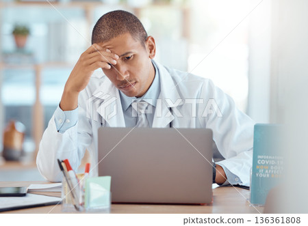 Headache, doctor and man at laptop in medical office with burnout challenge, clinic problem and stress. Frustrated healthcare worker at computer with fatigue, migraine pain and anxiety of 404 mistake 136361808