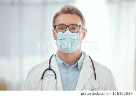 Man, portrait and doctor with face mask in hospital for medical services, surgery and wellness consulting. Male surgeon, mature therapist and healthcare manager working with safety ppe in clinic Man, portrait and doctor with face mask in hospital for medical services, surgery and wellness consulting. Male surgeon, mature therapist and healthcare manager working with safety ppe in clinic 136361824