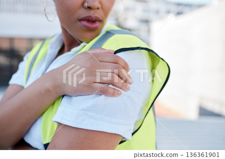 Woman, engineer and hands with shoulder pain outdoor from injury, accident and muscle tension on rooftop. Closeup of female contractor with sore arm, ache and joint inflammation at construction site 136361901