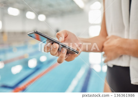 Phone, hands and athlete at swimming pool with social media, scrolling online or browsing internet after exercise. Swim, sports and person with cellphone for communication after workout or training 136361986