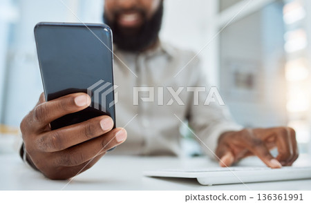 Business man, hands and typing on smartphone at computer in office for social network, mobile website and digital contact. Closeup of worker reading news, notification and app on cellphone at pc desk Business man, hands and typing on smartphone at computer in office for social network, mobile website and digital contact. Closeup of worker reading news, notification and app on cellphone at pc desk 136361991