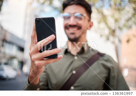 Phone, city and hand of business man online for chat, social media and network in town. Travel, professional and closeup of male worker on smartphone for communication, website and search on commute 136361997