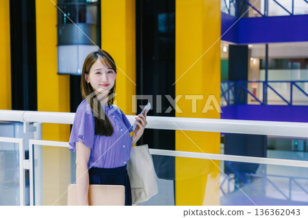Women walking shopping mall 136362043