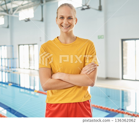 Portrait of woman, swimming pool and coach with arms crossed for exercise, fitness workout or sport. Face, swim and confident athlete, personal trainer or lifeguard, body health and happy in Canada Portrait of woman, swimming pool and coach with arms crossed for exercise, fitness workout or sport. Face, swim and confident athlete, personal trainer or lifeguard, body health and happy in Canada 136362062