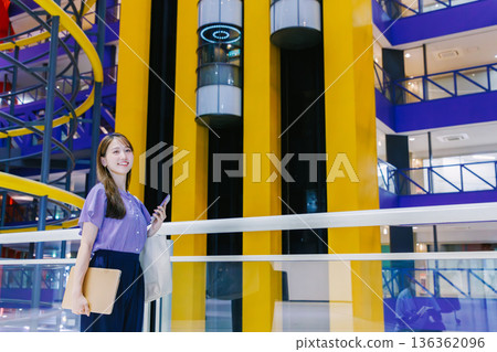 Women walking shopping mall Women walking shopping mall 136362096