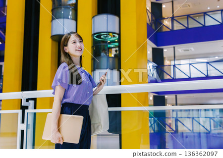 Women walking shopping mall 136362097