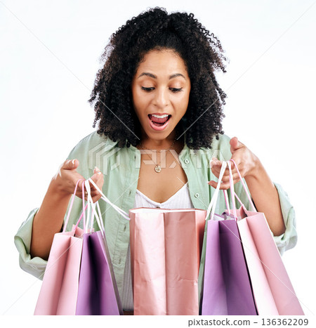 Wow, shopping bag and omg by woman in studio with promotion, deal or giveaway on white background. Retail, sale and female with open mouth shock for present, purchase or cashback sign up store gift 136362209