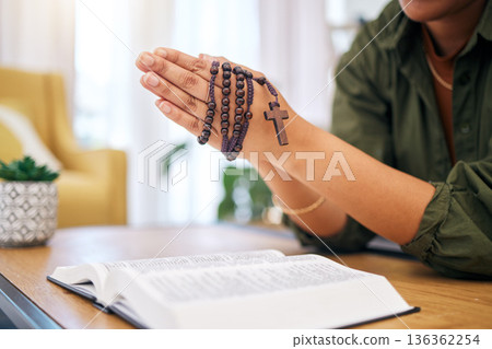 Hands, bible and home for prayer, rosary and mindfulness for faith, religion or reading with hope for future. Woman, praying and study holy book with cross for peace, mental health or worship to God Hands, bible and home for prayer, rosary and mindfulness for faith, religion or reading with hope for future. Woman, praying and study holy book with cross for peace, mental health or worship to God 136362254