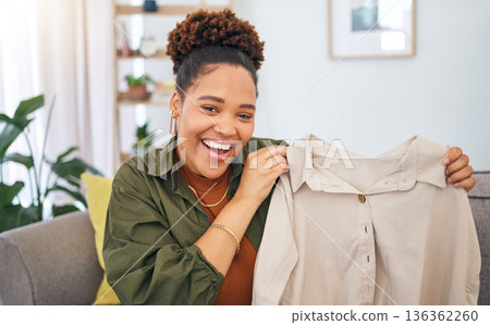 Fashion, influencer and a black woman streamer unboxing a clothes outfit in her home. Social media, brand deal and a happy female content creator recording a live broadcast for subscription service Fashion, influencer and a black woman streamer unboxing a clothes outfit in her home. Social media, brand deal and a happy female content creator recording a live broadcast for subscription service 136362260