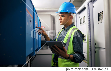 Electrician, tablet and man, control room and inspection, maintenance check with power supply and engineering. Electricity, industrial and male technician, digital assessment and quality assurance Electrician, tablet and man, control room and inspection, maintenance check with power supply and engineering. Electricity, industrial and male technician, digital assessment and quality assurance 136362341
