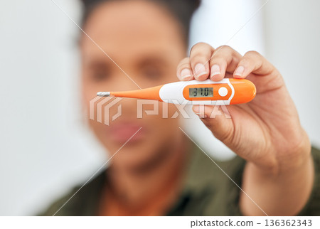 Fever, check temperature and woman with thermometer for flu, cold and and sick at home. Healthcare, medical testing and closeup of female person with measuring tool for virus, infection and illness 136362343