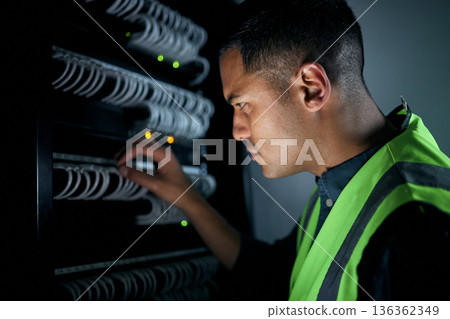 Technician man, server room and inspection for cables, thinking and focus for analysis, night and programming. Information technology engineer, maintenance and database with problem solving mindset 136362349