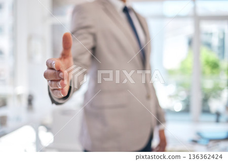 Closeup of a businessman stretching for a handshake in the office for partnership, greeting or agreement. Success, welcome and zoom of professional male person with shaking hands gesture for welcome. Closeup of a businessman stretching for a handshake in the office for partnership, greeting or agreement. Success, welcome and zoom of professional male person with shaking hands gesture for welcome. 136362424
