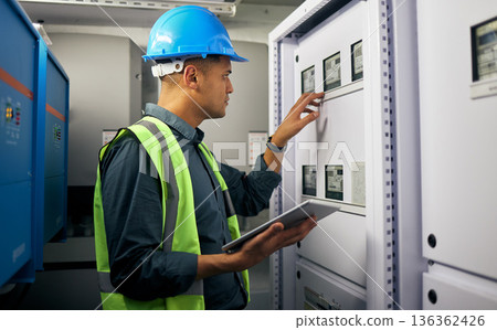 Technician, tablet and man, control room and inspection, maintenance check with power supply and engineering. Electricity, industrial and male electrician, digital assessment and quality assurance Technician, tablet and man, control room and inspection, maintenance check with power supply and engineering. Electricity, industrial and male electrician, digital assessment and quality assurance 136362426