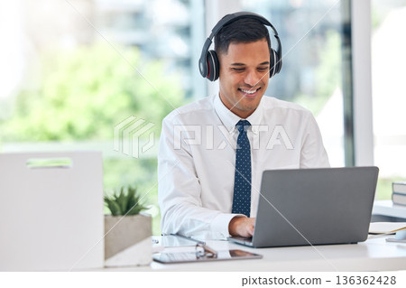 Businessman, laptop and typing email with headphones in communication, networking or listening to music at office. Happy man, accountant or financial advisor working on computer for business proposal Businessman, laptop and typing email with headphones in communication, networking or listening to music at office. Happy man, accountant or financial advisor working on computer for business proposal 136362428