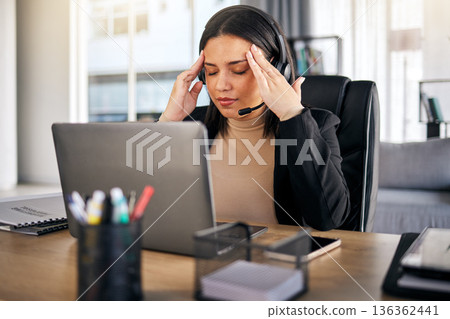 Woman, call center and headache in stress, mistake or client problem on laptop at office desk. Frustrated female person, consultant or agent with bad head pain, anxiety or burnout at the workplace Woman, call center and headache in stress, mistake or client problem on laptop at office desk. Frustrated female person, consultant or agent with bad head pain, anxiety or burnout at the workplace 136362441