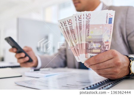 Businessman, money and phone with documents for accounting, budget planning or finance on office desk. Closeup of man or accountant hands with cash and smartphone in savings, audit or salary on table Businessman, money and phone with documents for accounting, budget planning or finance on office desk. Closeup of man or accountant hands with cash and smartphone in savings, audit or salary on table 136362444