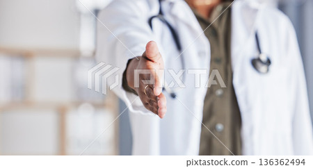 Hand, doctor and closeup greeting for healthcare, medical support or meeting at a hospital. Medicine, hello and a nurse or surgeon with a handshake, welcome or help during a consultation at a clinic Hand, doctor and closeup greeting for healthcare, medical support or meeting at a hospital. Medicine, hello and a nurse or surgeon with a handshake, welcome or help during a consultation at a clinic 136362494