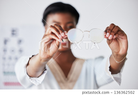 Hands, woman and optician with glasses for vision, eyesight and eye care prescription lens. Closeup of doctor, optometrist and frame for eyewear, test and consulting for optical assessment in clinic Hands, woman and optician with glasses for vision, eyesight and eye care prescription lens. Closeup of doctor, optometrist and frame for eyewear, test and consulting for optical assessment in clinic 136362502