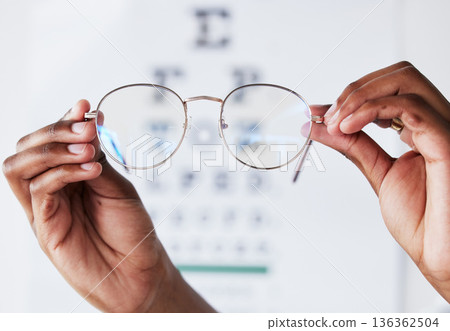 Hands, person and optometrist with glasses for vision, eye care and eyesight prescription. Closeup of optician, doctor and lens frame for eyewear, test and consulting of optical healthcare assessment Hands, person and optometrist with glasses for vision, eye care and eyesight prescription. Closeup of optician, doctor and lens frame for eyewear, test and consulting of optical healthcare assessment 136362504