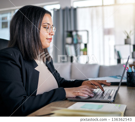 Woman, typing and laptop in office with thinking, planning or post schedule for blog content creator. Copywriting expert, website manager and computer with mindset, ideas or social media in workplace 136362543