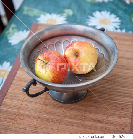 Two Apples in Vase on Table. 136362601