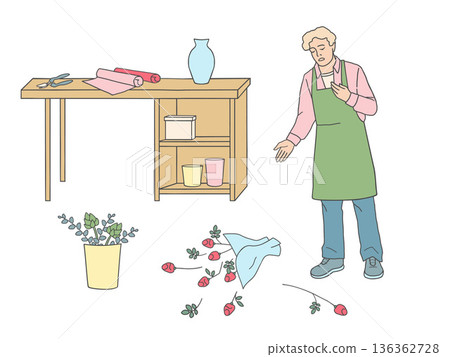 Vector illustration of a male florist in apron near a workbench with scissors and wrapping paper. Fallen bouquet on the floor, flower arrangement process and working moment on white background. 136362728