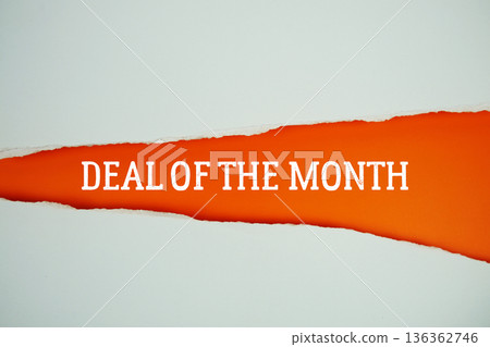 Deal Of The Month text on orange with white paper torn ripped of horizontal Deal Of The Month text on orange with white paper torn ripped of horizontal 136362746
