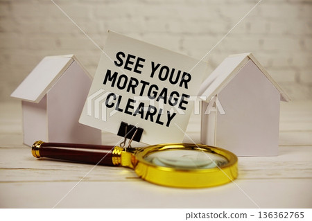 See Your Mortgage Clearly with magnifying glass and house model on wooden background See Your Mortgage Clearly with magnifying glass and house model on wooden background 136362765