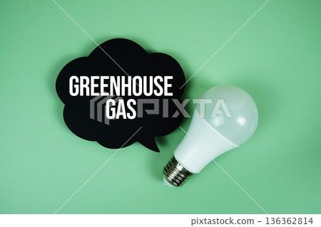 Greenhouse Gas text with light bulb on green background Greenhouse Gas text with light bulb on green background 136362814