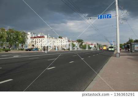 The road between houses in bad weather A cloudy day in the city The road between houses in bad weather A cloudy day in the city 136363291